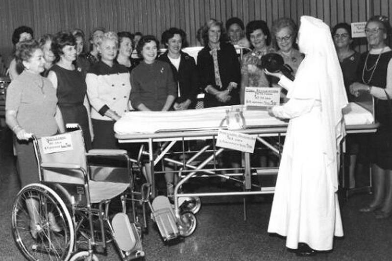 SMGH ladies' auxiliary group learning about new medical equipment